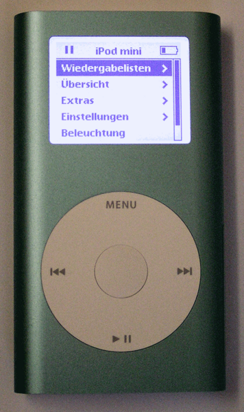 Green first-generation Apple iPod mini with gray click wheel text, shown face-on.