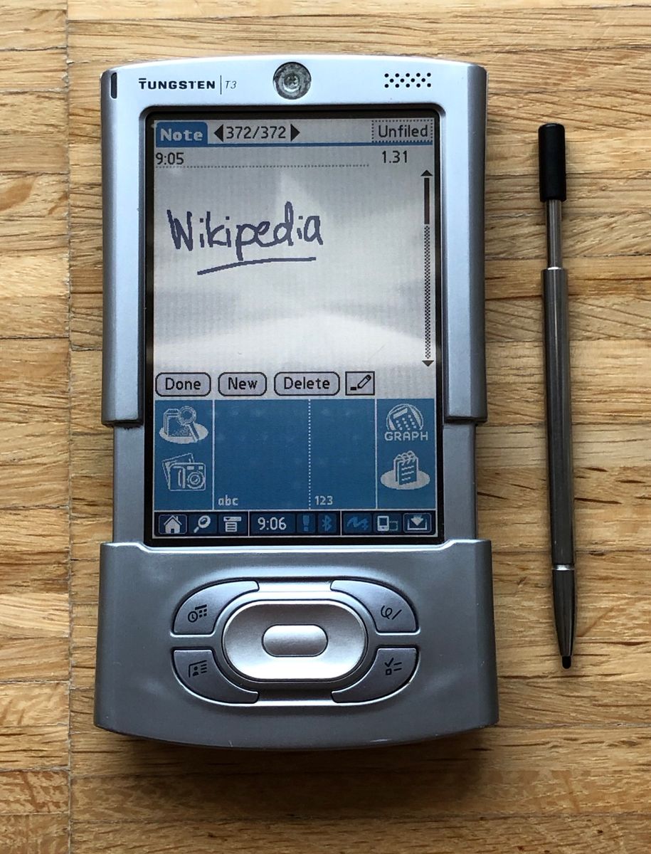 Palm Tungsten T3 with sliding Graffiti area extended and stylus alongside.